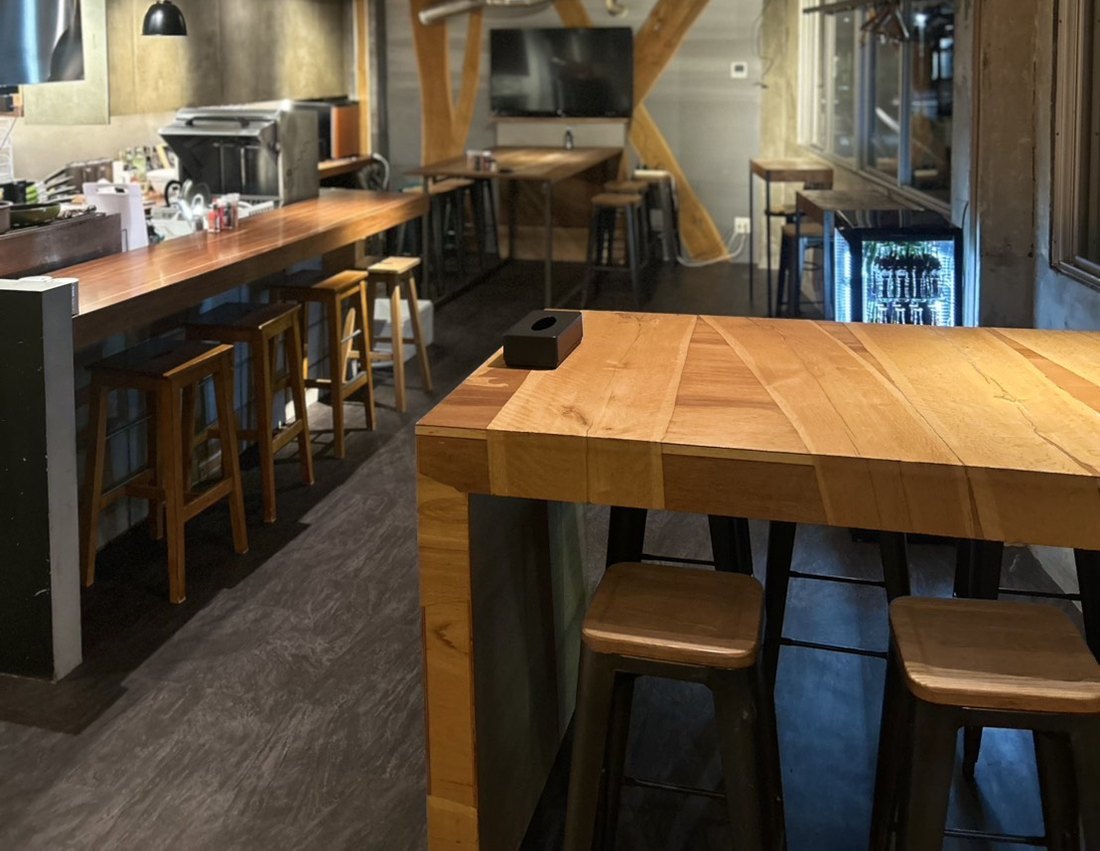 The counter and high table, with the 50-inch monitor at the far end of the floor